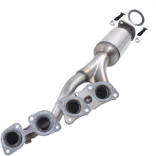 Metallic exhaust manifold with gaskets on a white background